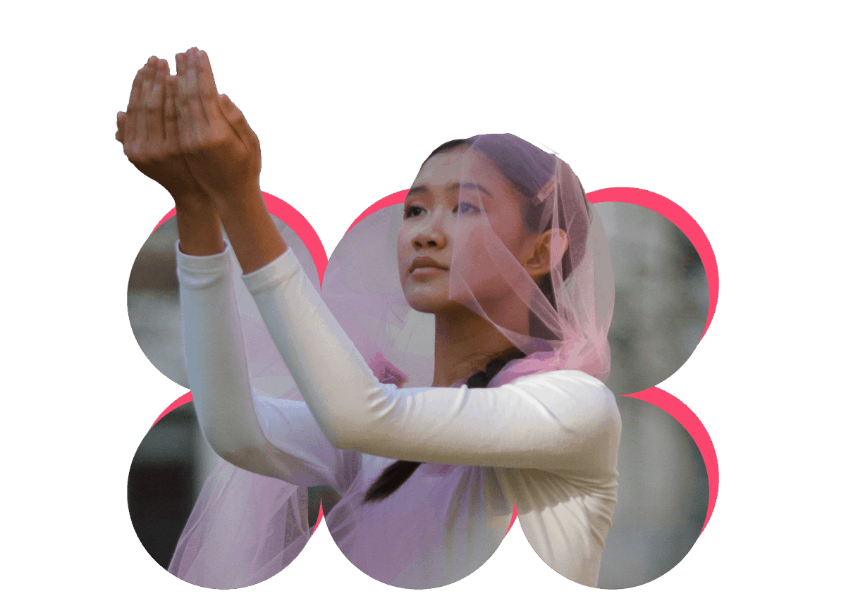 A cutout image of a dancer popping out of a fun, modern shape. She wears a pink veil-like headpiece, and is gesturing forward with both arms, hands cupped together.