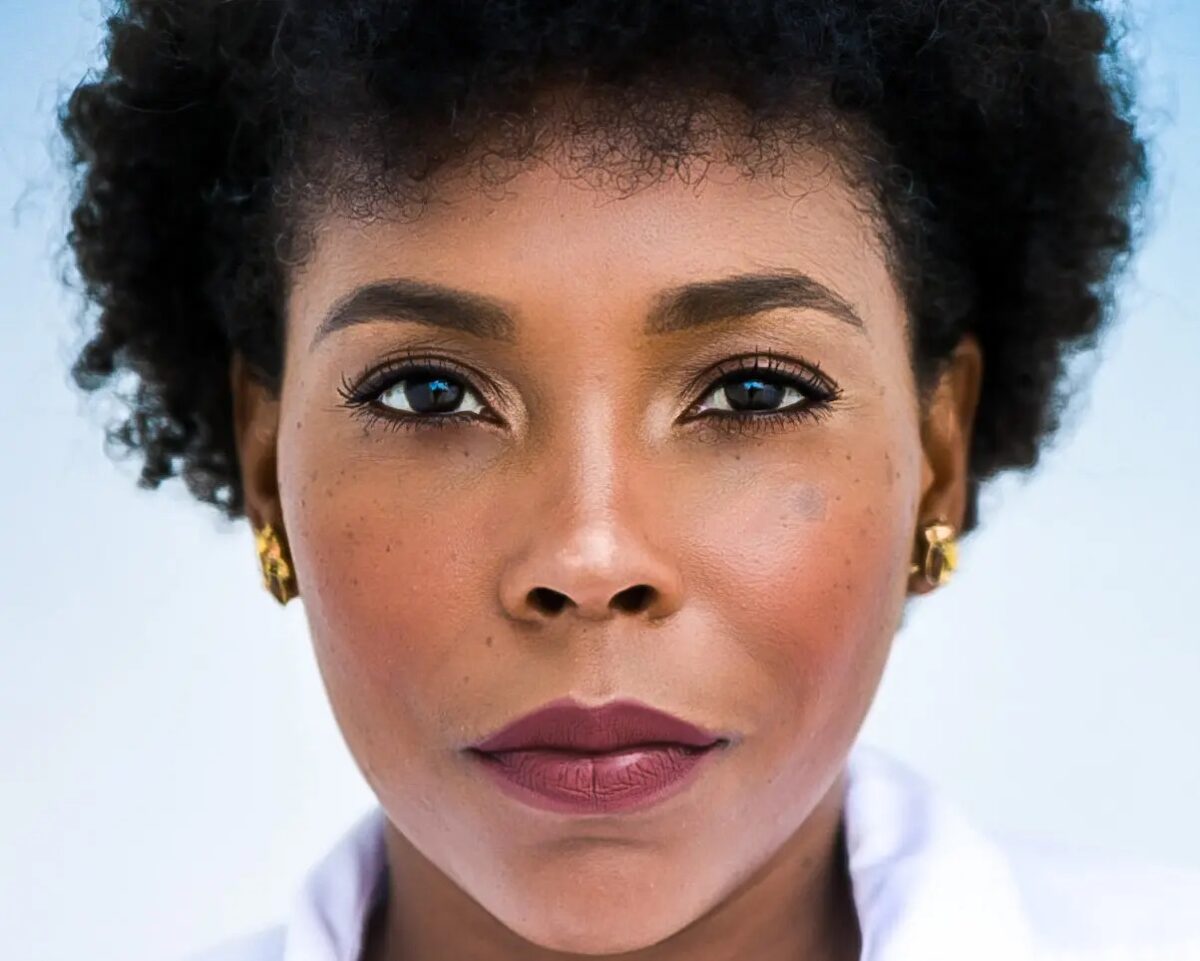 Headshot of Dionne Figgins, Artistic Director of Ballet Tech, looking straight at the camera intently.