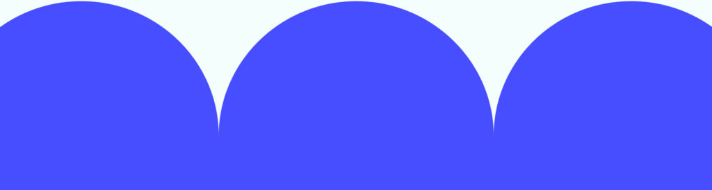 A bright blue modern cut out shape, with three large half-circle curves.