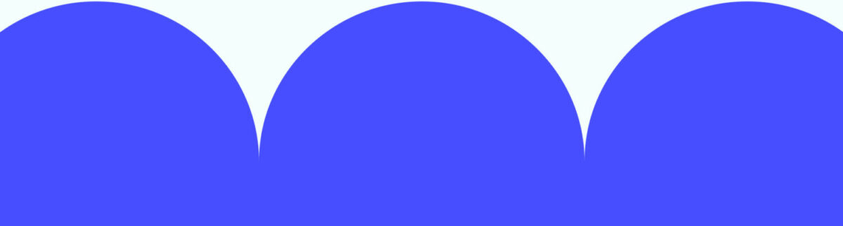 A bright blue modern cut out shape, with three large half-circle curves.