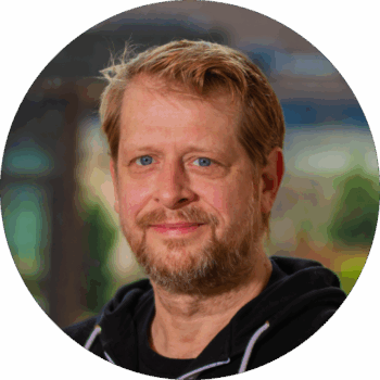 Headshot of Brian Reeder, Ballet teacher, smiling.