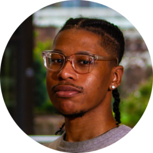 Headshot of Darren Thomas, Program Coordinator, looking intently.