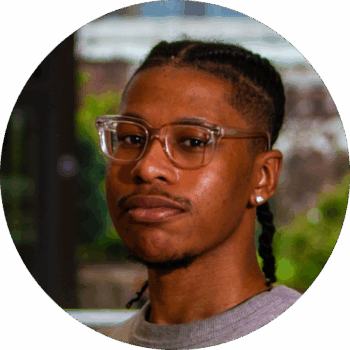 Headshot of Darren Thomas, Program Coordinator, looking intently.