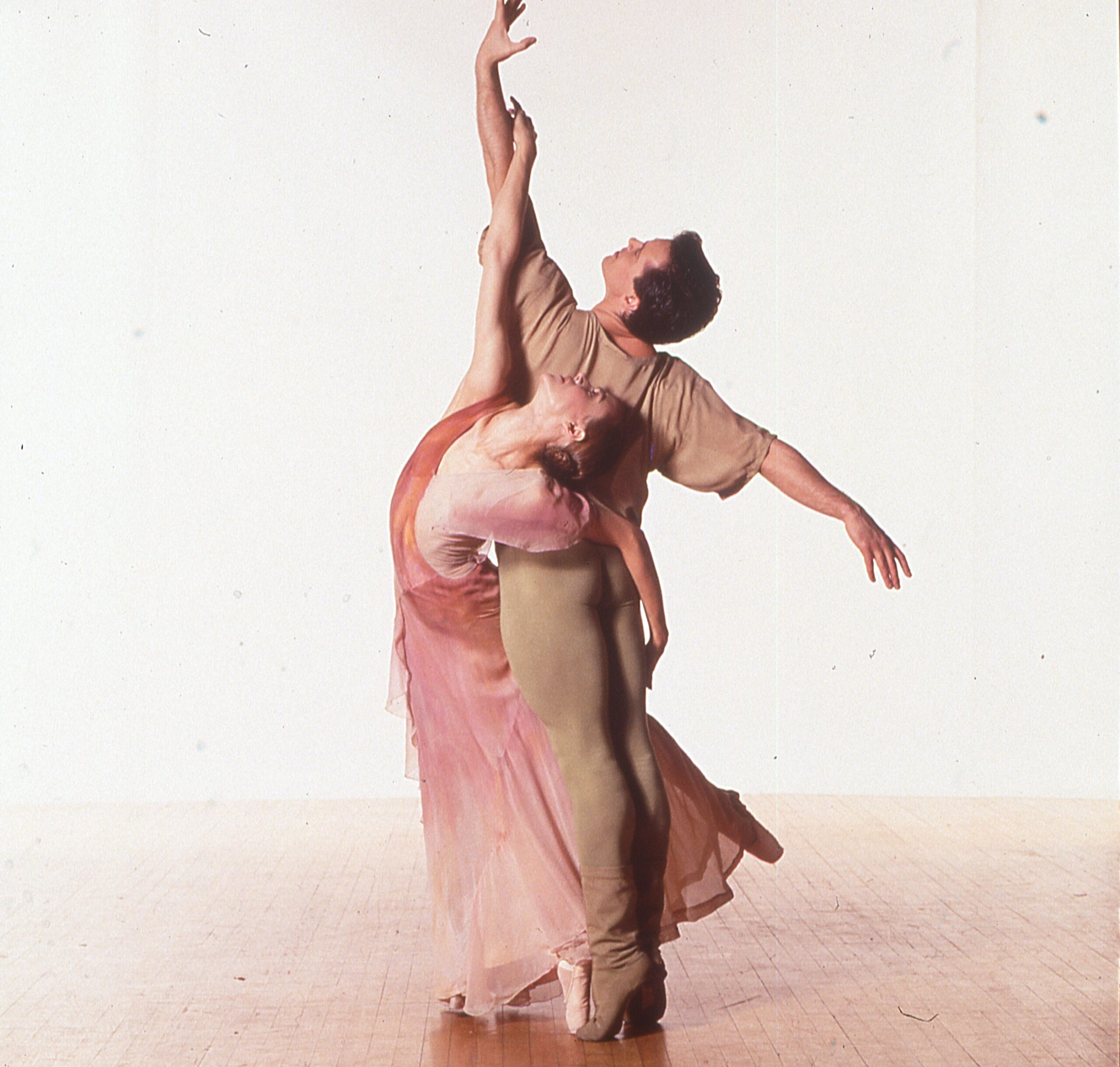 A man and a woman dancer wrap themselves around each other gracefully, in performance of Eliot Feld&#039;s &quot;Endsong.&quot;