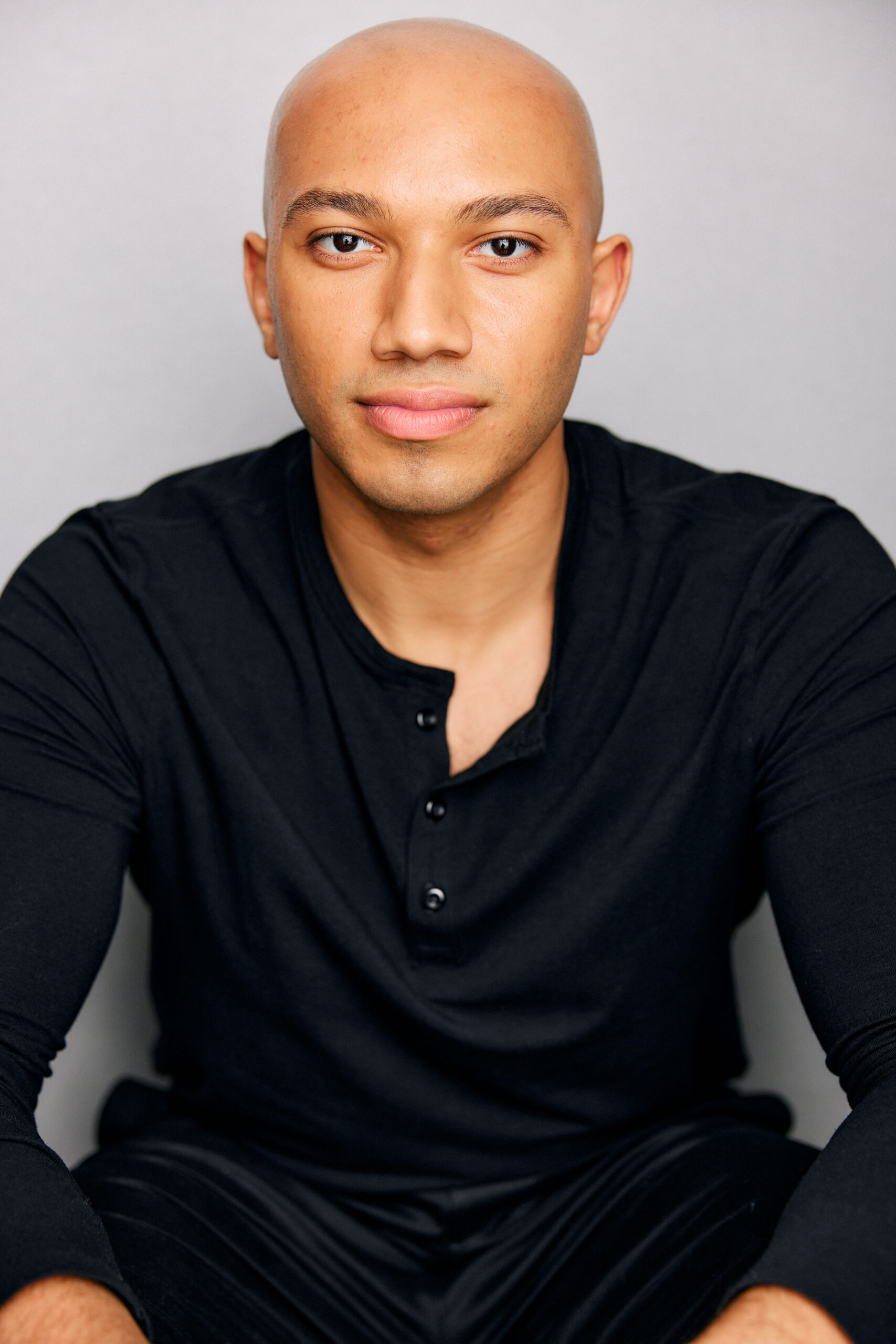 Headshot of John Manzari, Tap Instructor, looking straight at the camera.